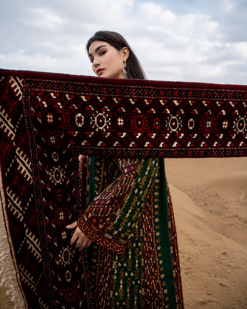 Commissioned dress and Turkmen carpet in desert light